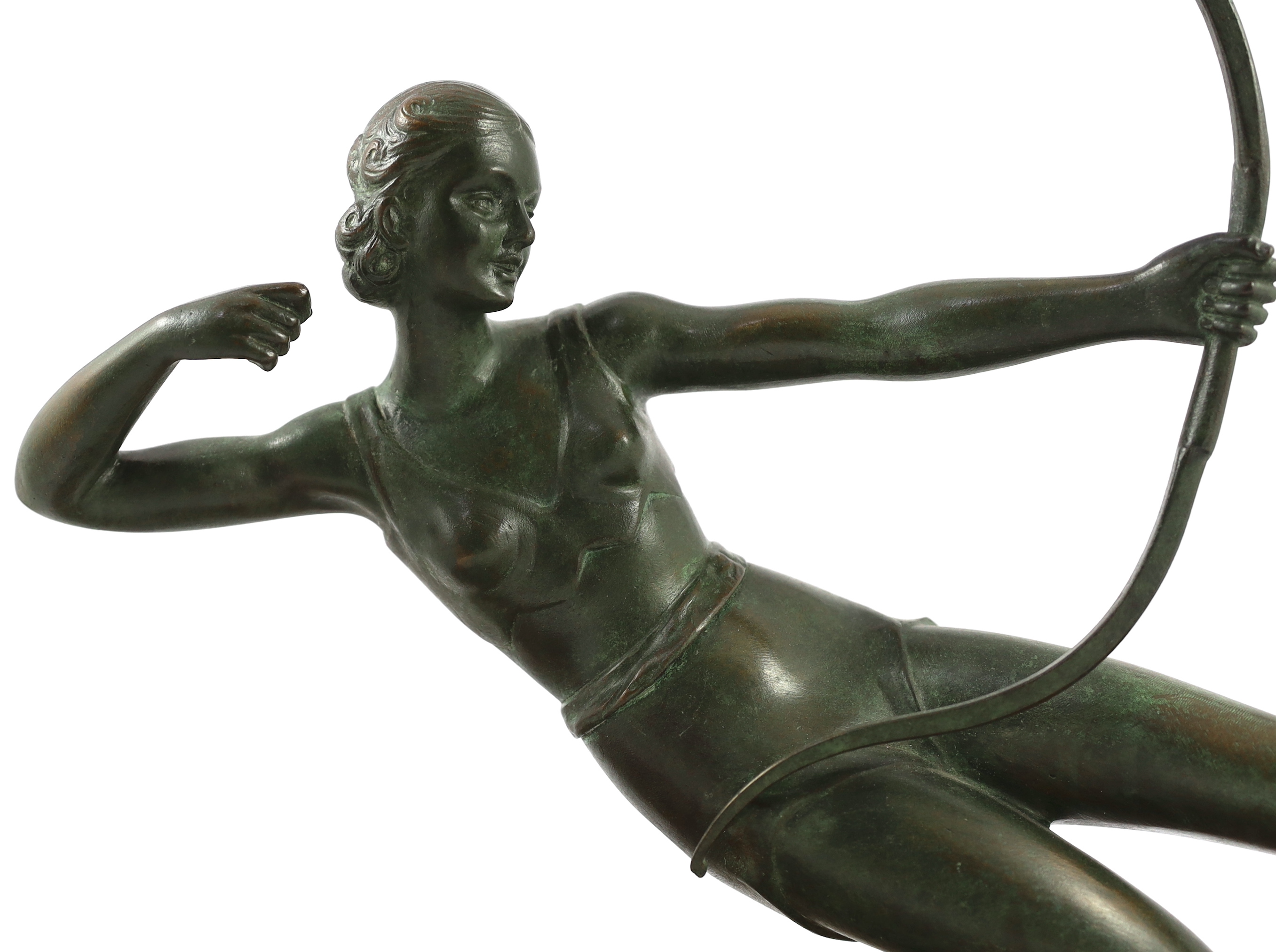 Salvatore Melani (Italian, 1902-1934). An Art Deco bronze figure of a female archer, 57cm wide, 17cm deep, 38cm high